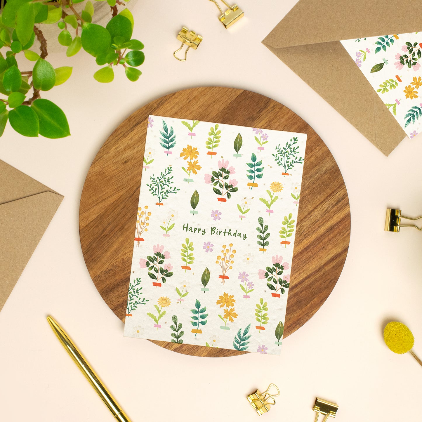 Plantable birthday card with wildflowers on a wooden board
