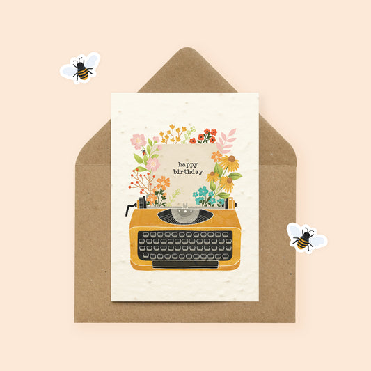 Plantable typewriter birthday card with wildflowers