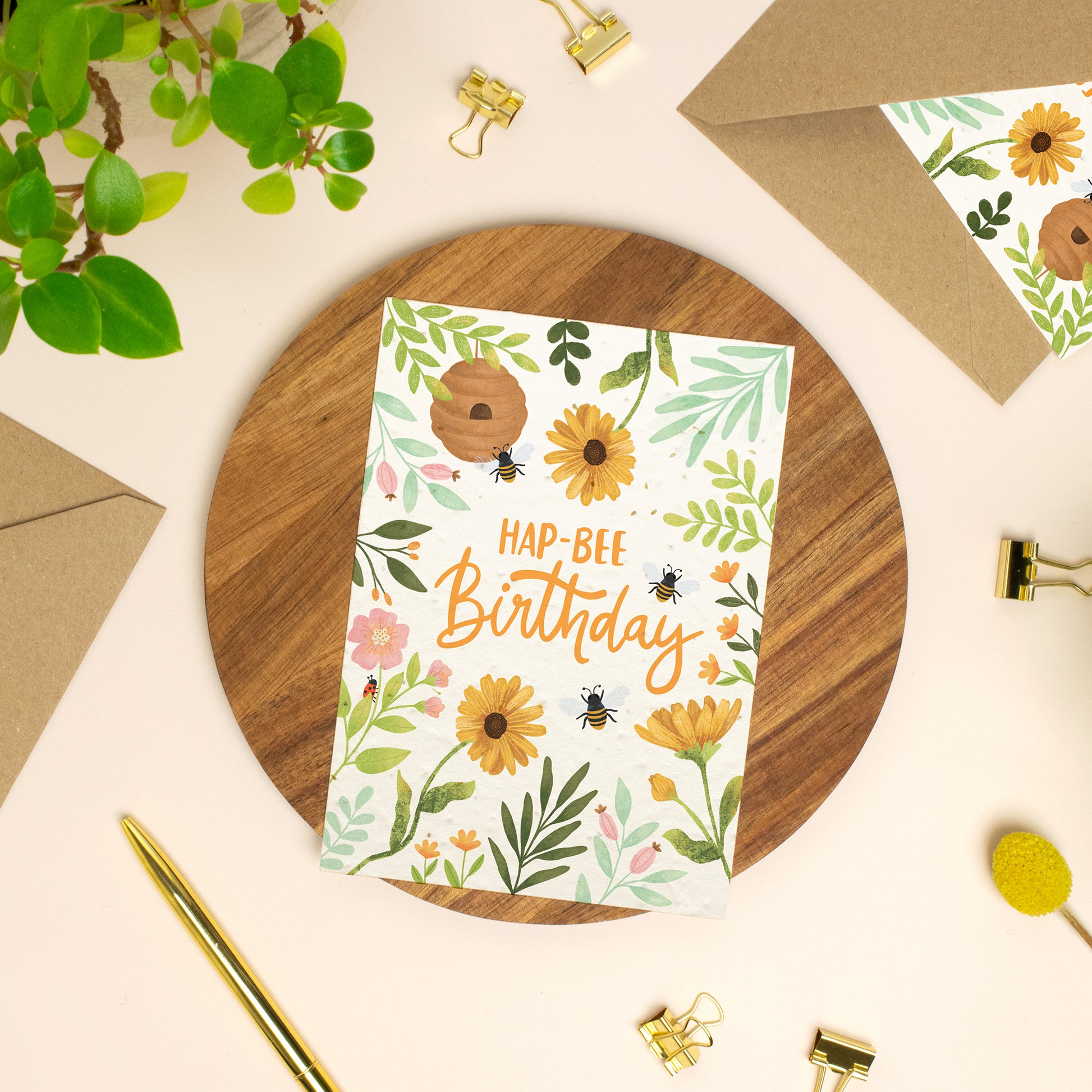Plantable birthday card with Bees and wildflowers on a wooden board
